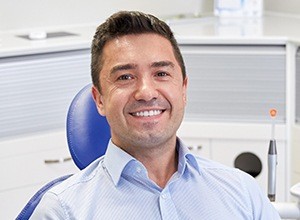 Smiling man in dental chair