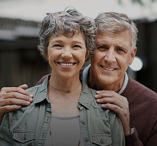 Senior man and woman smiling together