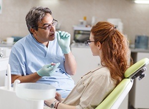 Dentist talking to patient about laser dentistry