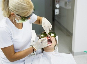 Patient receiving laser dental treatment